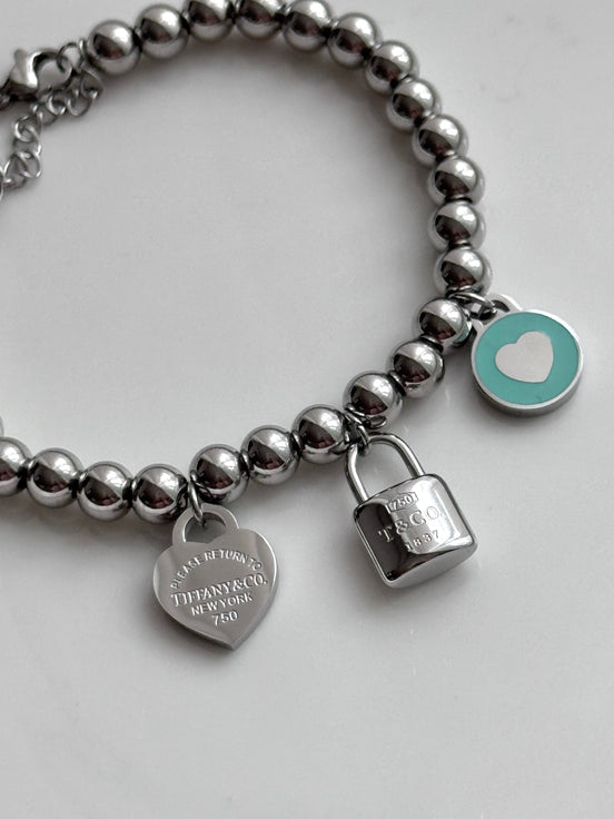 PULSERA BOLITAS CON DIJES