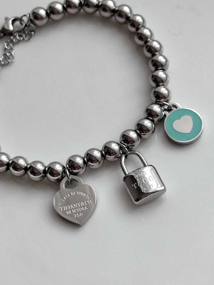 PULSERA BOLITAS CON DIJES