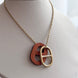 COLLAR H NARANJA