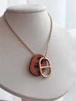 COLLAR H NARANJA