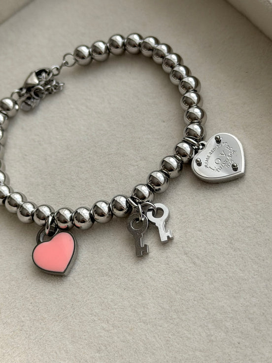 PULSERA BOLITAS CON LLAVES