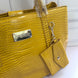BOLSA BEBE AUBREY CROCO AMARILLA