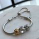 PULSERA CON CHARMS