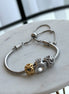 PULSERA CON CHARMS
