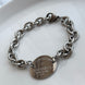 PULSERA TFNY PLACA OVALADA