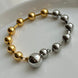 PULSERA BOLITAS BICOLOR