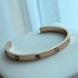PULSERA ABIERTA CON ZIRCONIAS DE COLORES