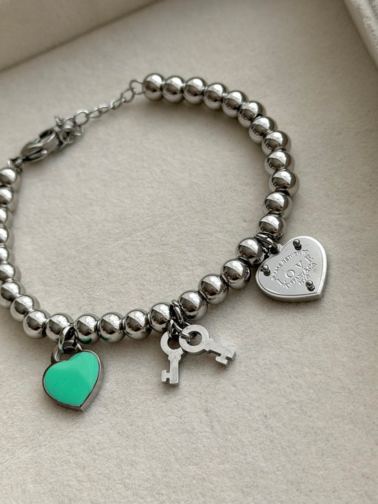 PULSERA BOLITAS CON DIJES