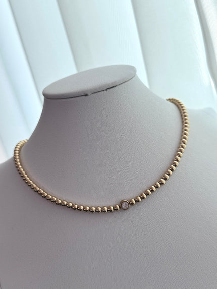 COLLAR BOLITAS CON ZIRCONIA DORADO