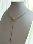 COLLAR CORBATERO NUDO Y GOTA